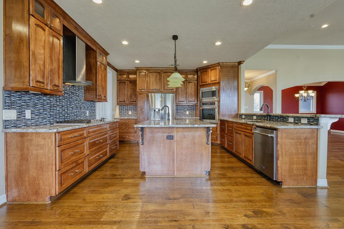 Chandelier, Interior, Kitchen, Pendant Lights, Recessed Lighting, Stainless Steel Appliances, Wood Texture Flooring