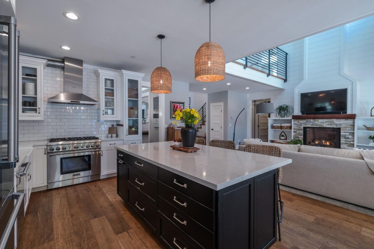 Fireplace, Interior, Kitchen, Living room, Pendant Lights, Recessed Lighting, Stainless Steel Appliances, Wood Texture Flooring