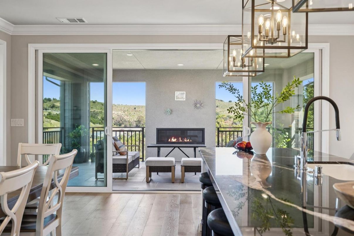 Dining room, Fireplace, Interior, Living room, Pendant Lights, Recessed Lighting, Wood Texture Flooring