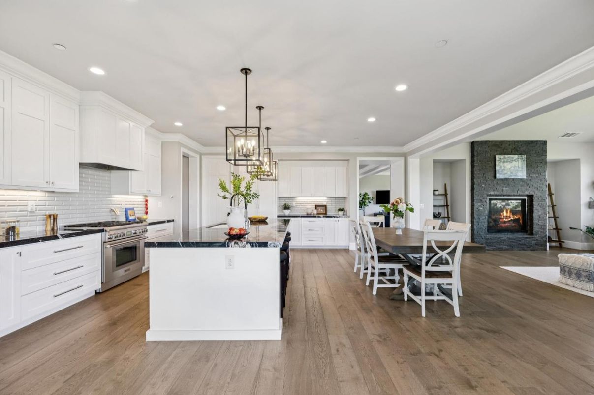 Dining room, Fireplace, Interior, Kitchen, Pendant Lights, Recessed Lighting, Stainless Steel Appliances, Wood Texture Flooring