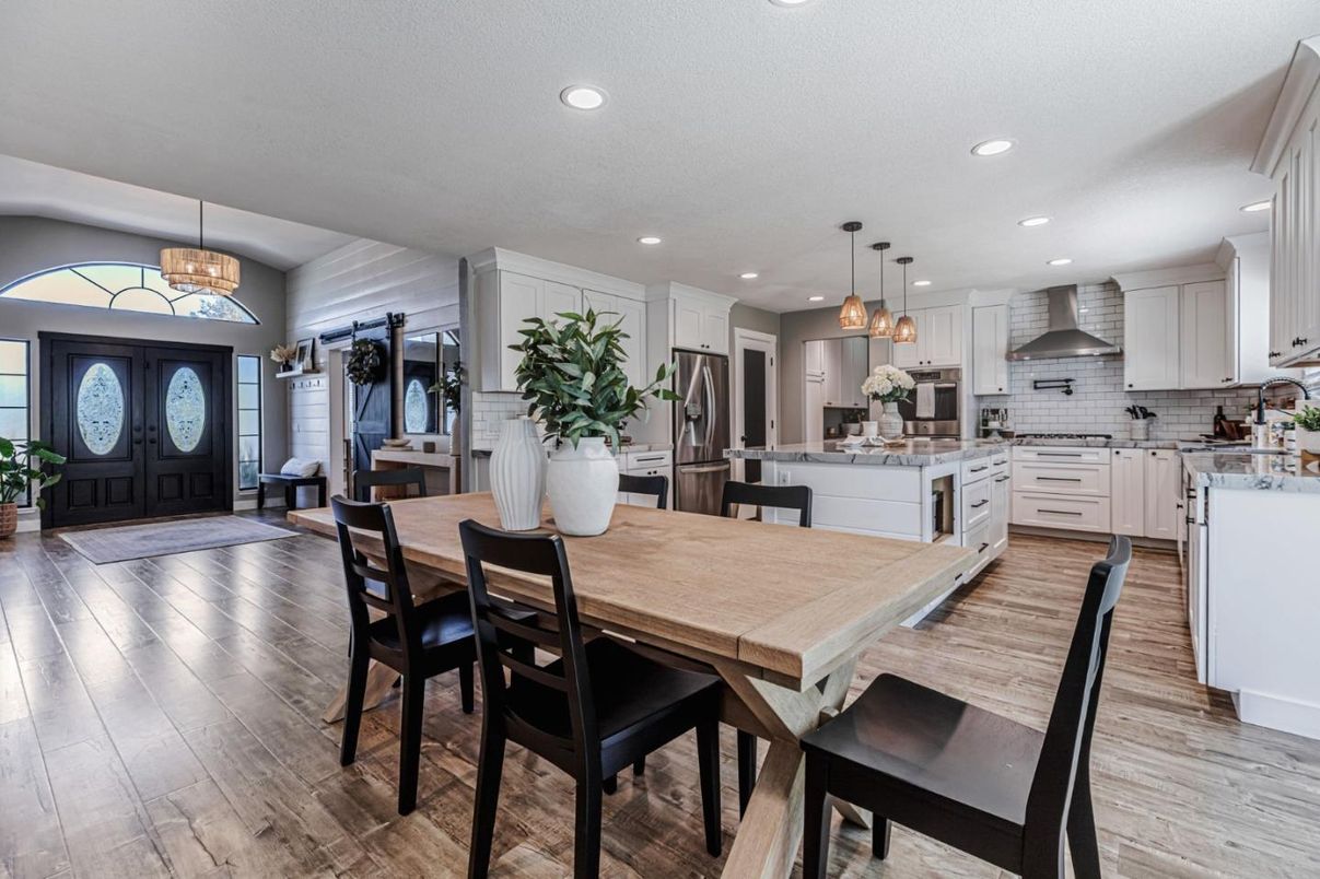 Dining room, Interior, Kitchen, Pendant Lights, Recessed Lighting, Stainless Steel Appliances, Wood Texture Flooring