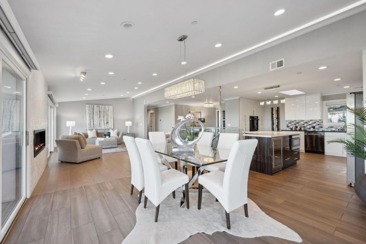 Chandelier, Dining room, Fireplace, Interior, Kitchen, Living room, Pendant Lights, Recessed Lighting, Stainless Steel Appliances, Wood Texture Flooring