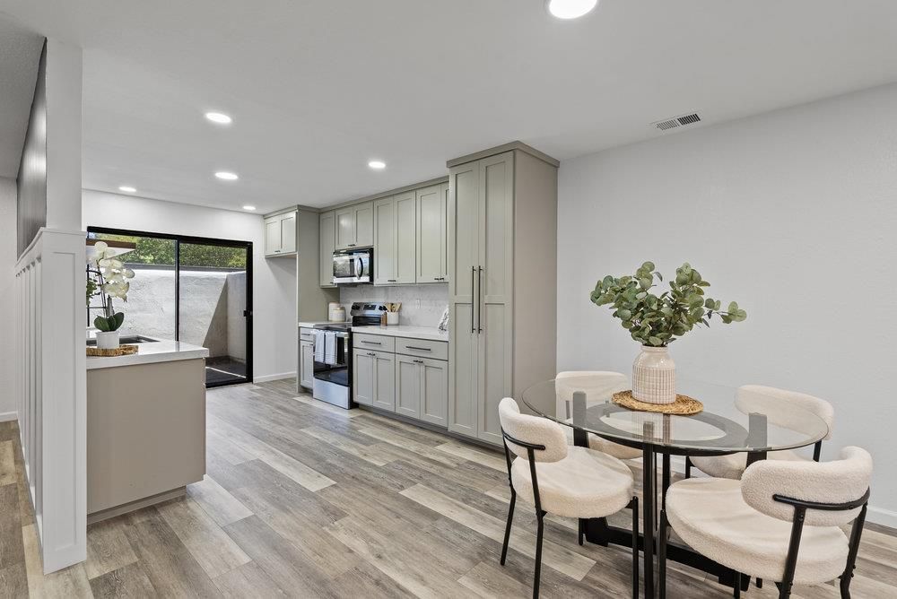 Dining room, Interior, Kitchen, Recessed Lighting, Stainless Steel Appliances, Wood Texture Flooring