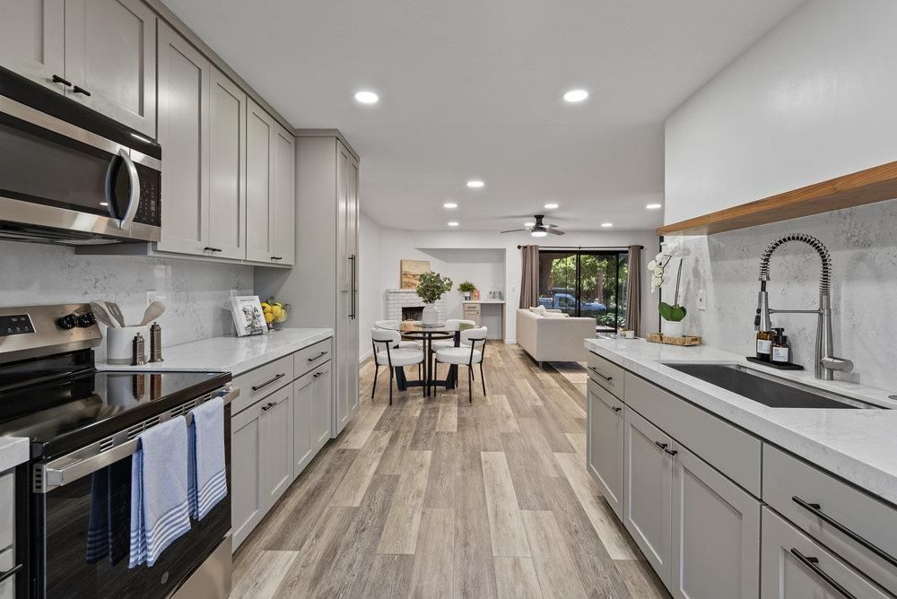 Dining room, Interior, Kitchen, Recessed Lighting, Stainless Steel Appliances, Wood Texture Flooring