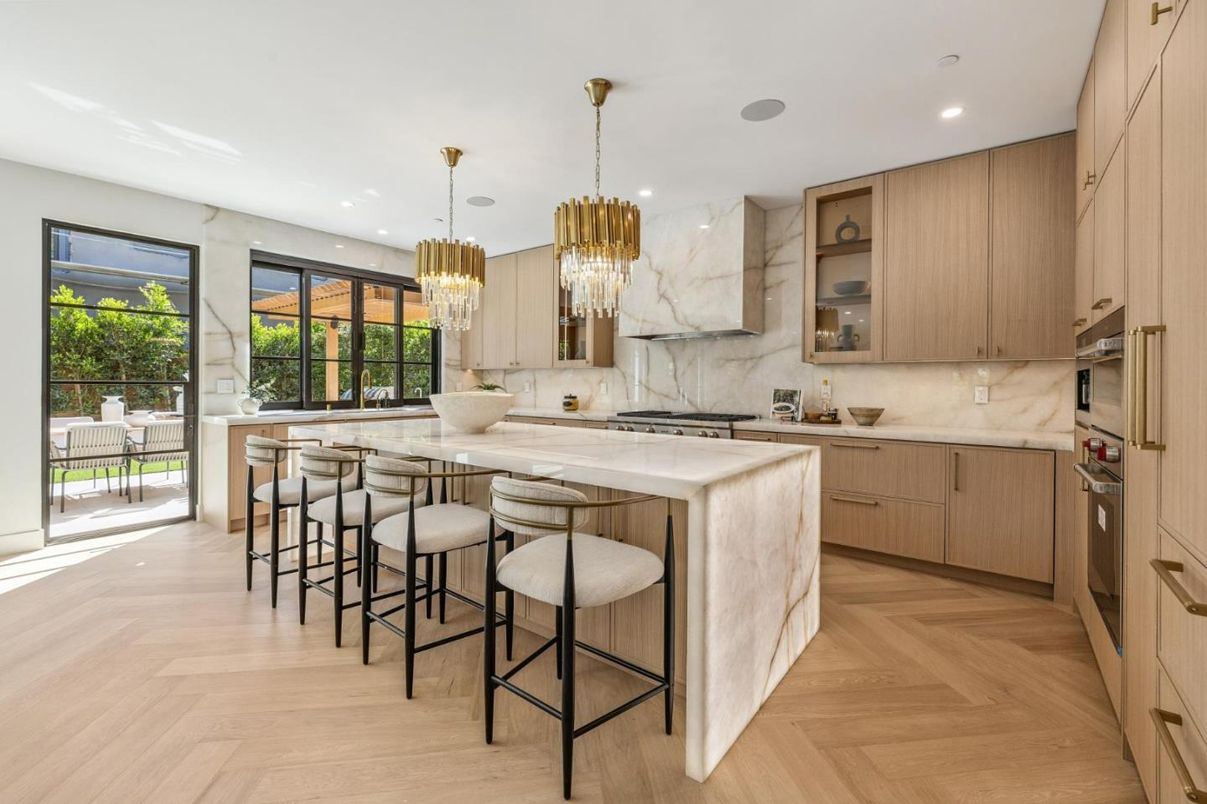 Chandelier, Interior, Kitchen, Marble Walls, Pendant Lights, Recessed Lighting, Stainless Steel Appliances, Wood Texture Flooring