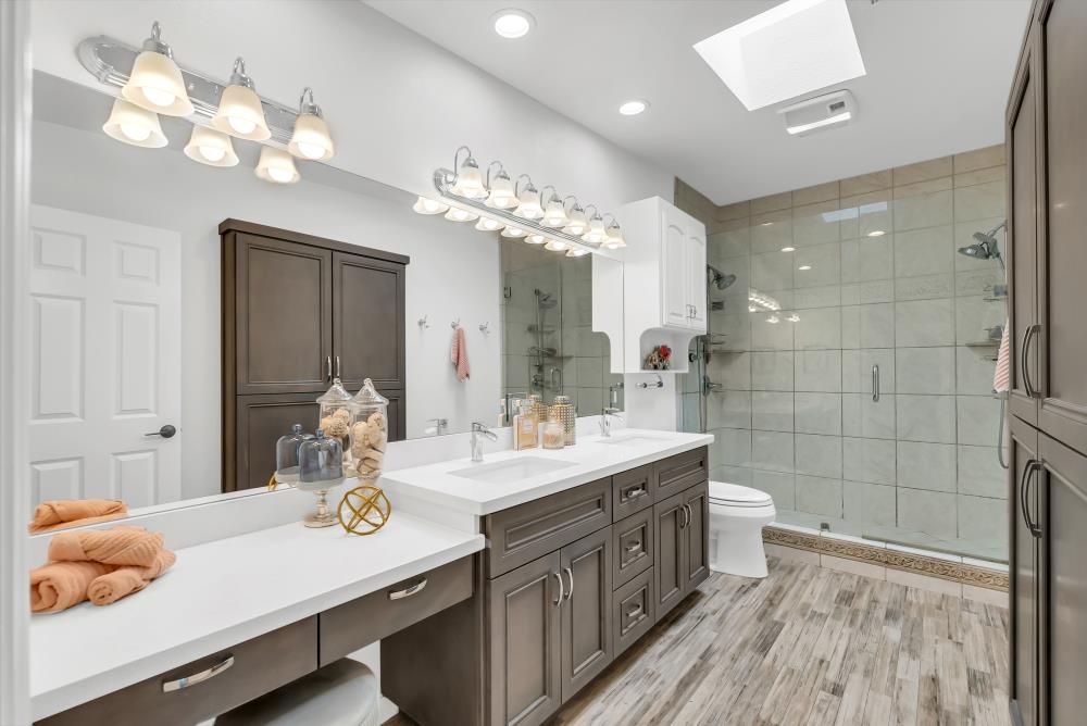 Bathroom, Dual Sink Vanities, Glass Shower, Interior, Recessed Lighting, Wood Texture Flooring