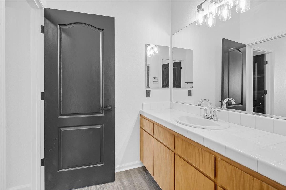 Bathroom, Dual Sink Vanities, Interior, Tile Countertops, Wood Texture Flooring