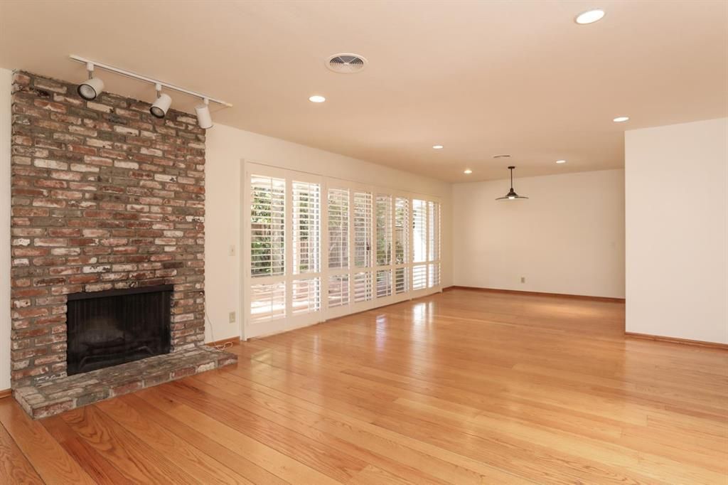 Empty room, Fireplace, Interior, Pendant Lights, Recessed Lighting, Stone Walls, Wood Texture Flooring