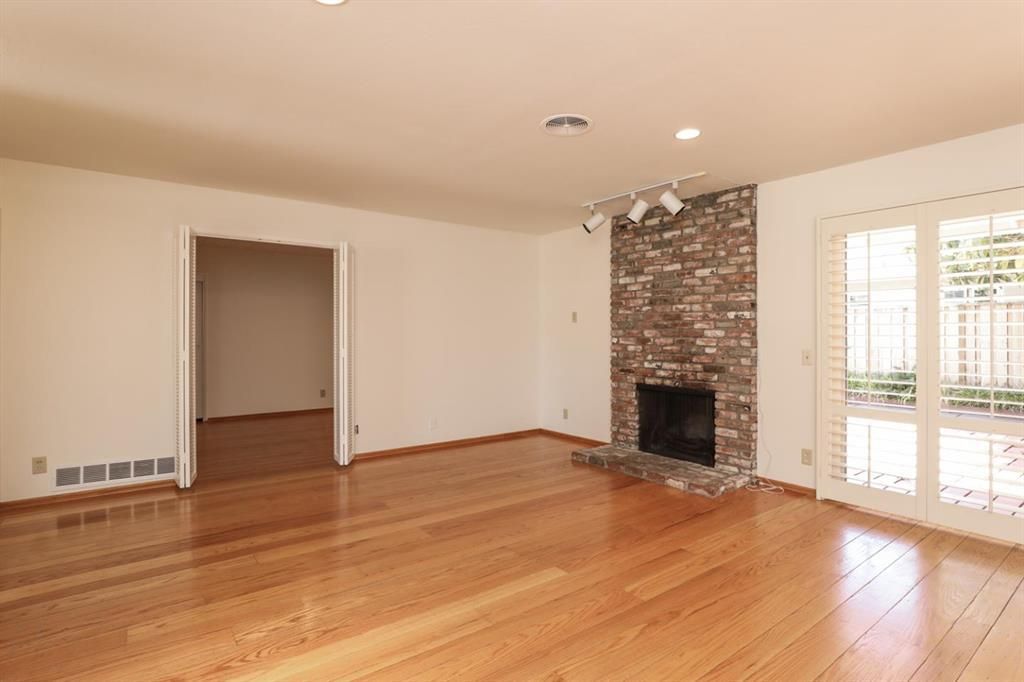 Empty room, Fireplace, Interior, Recessed Lighting, Stone Walls, Wood Texture Flooring