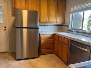 Interior, Kitchen, Stainless Steel Appliances, Tile Countertops, Wood Texture Flooring