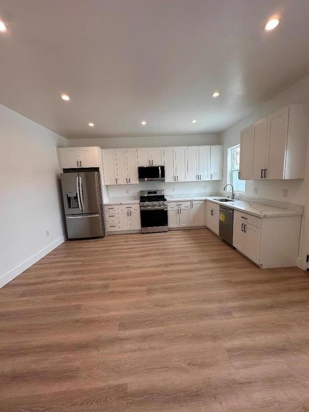 Interior, Kitchen, Recessed Lighting, Stainless Steel Appliances, Wood Texture Flooring