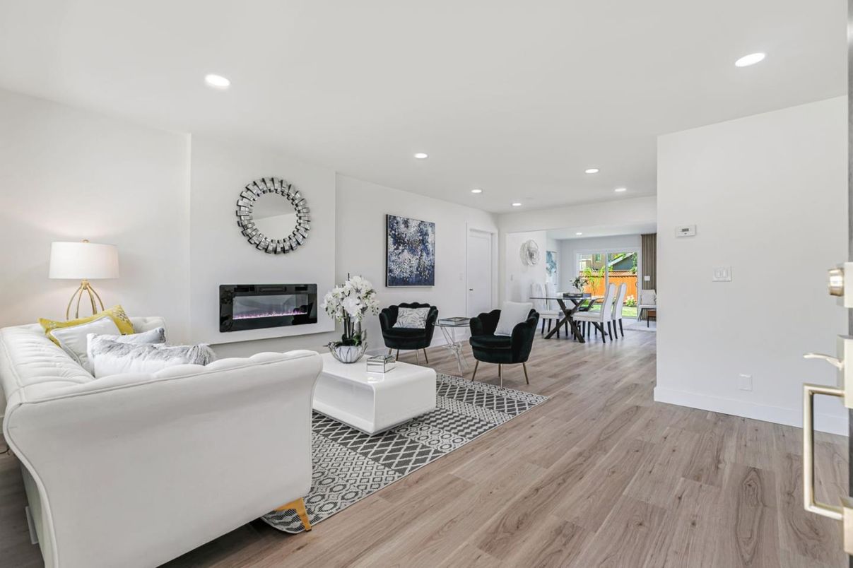 Dining room, Fireplace, Interior, Living room, Recessed Lighting, Wood Texture Flooring