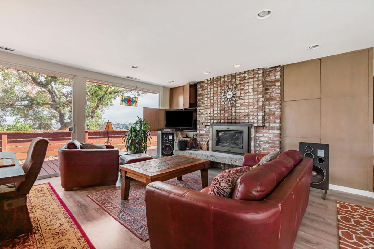 Fireplace, Interior, Living room, Recessed Lighting, Stone Walls, Wood Texture Flooring