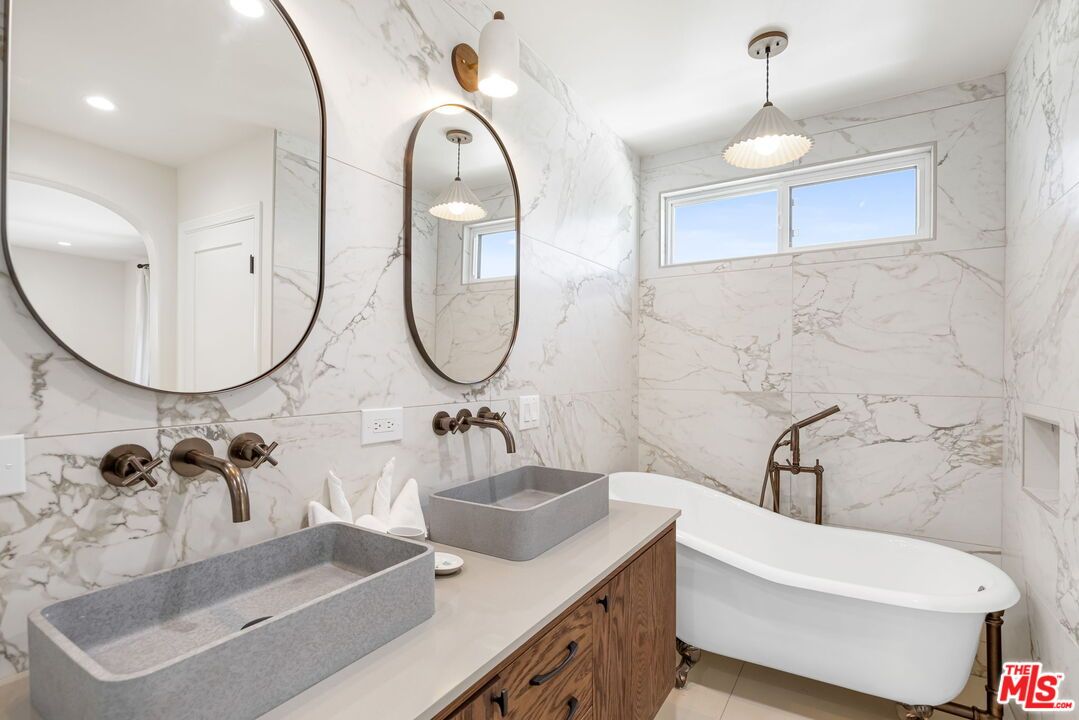 Bathroom, Dual Sink Vanities, Free Standing Baths, Interior, Marble Walls, Pendant Lights, Recessed Lighting