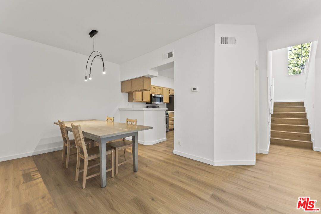 Dining room, Interior, Kitchen, Pendant Lights, Stainless Steel Appliances, Wood Texture Flooring