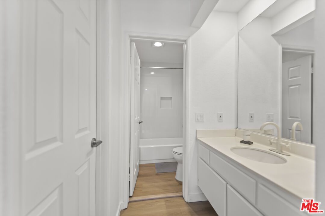 Bathroom, Dual Sink Vanities, Interior, Recessed Lighting, Wood Texture Flooring