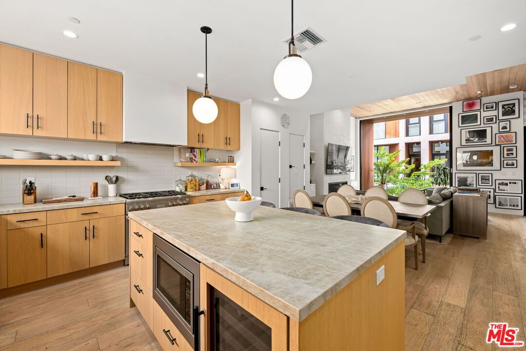 Dining room, Interior, Kitchen, Pendant Lights, Recessed Lighting, Stainless Steel Appliances, Wood Texture Flooring