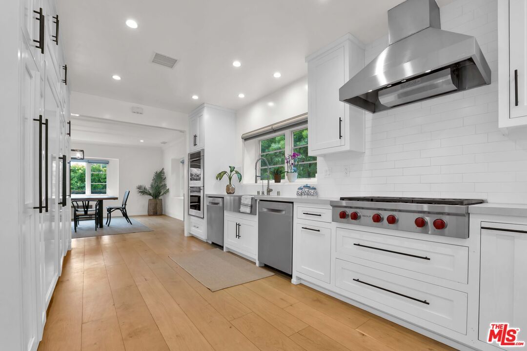 Dining room, Interior, Kitchen, Recessed Lighting, Stainless Steel Appliances, Wood Texture Flooring