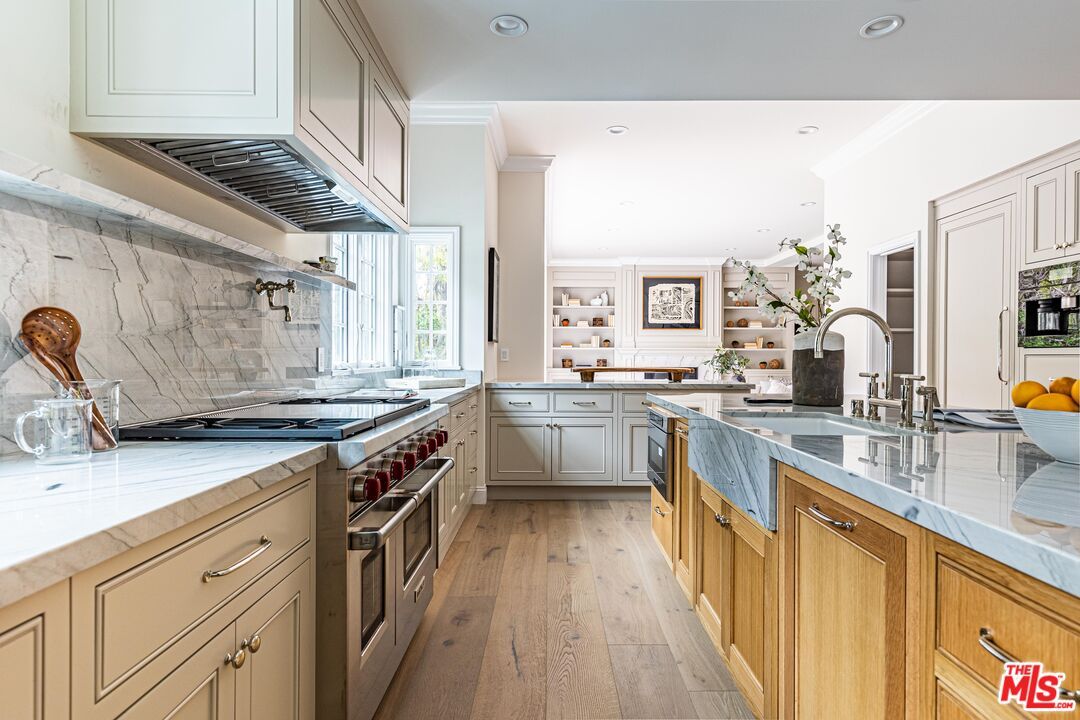 Interior, Kitchen, Marble Walls, Recessed Lighting, Stainless Steel Appliances, Wood Texture Flooring
