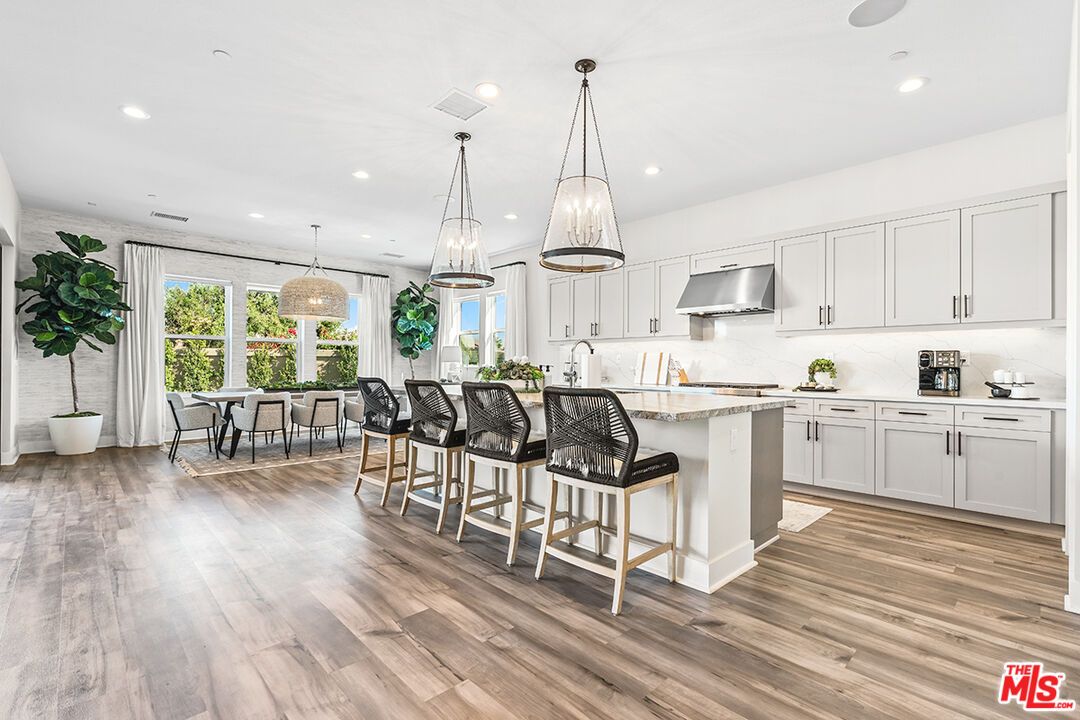 Dining room, Interior, Kitchen, Pendant Lights, Recessed Lighting, Stainless Steel Appliances, Wood Texture Flooring