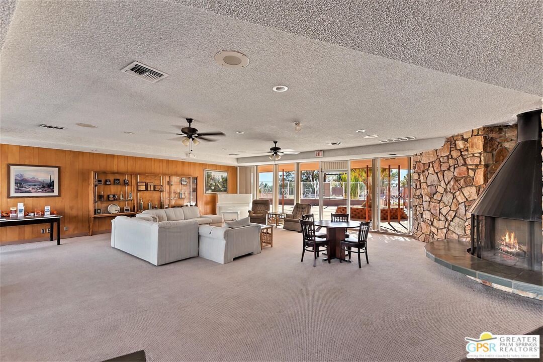Dining room, Fireplace, Interior, Living room, Recessed Lighting, Stone Walls, Wooden Walls