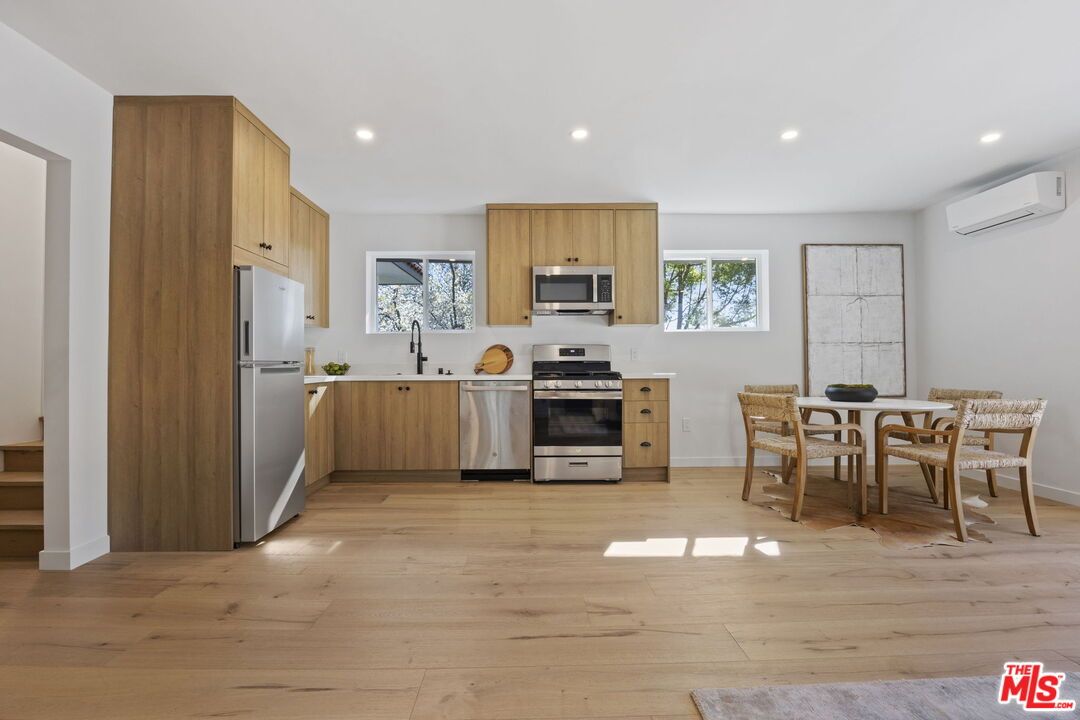 Dining room, Interior, Kitchen, Recessed Lighting, Stainless Steel Appliances, Wood Texture Flooring