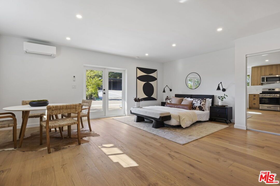 Bedroom, Dining room, Interior, Kitchen, Recessed Lighting, Stainless Steel Appliances, Wood Texture Flooring