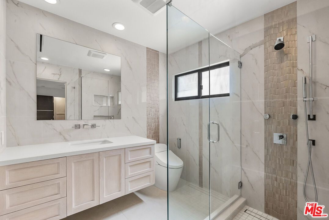 Bathroom, Dual Sink Vanities, Glass Shower, Interior, Marble Walls, Recessed Lighting