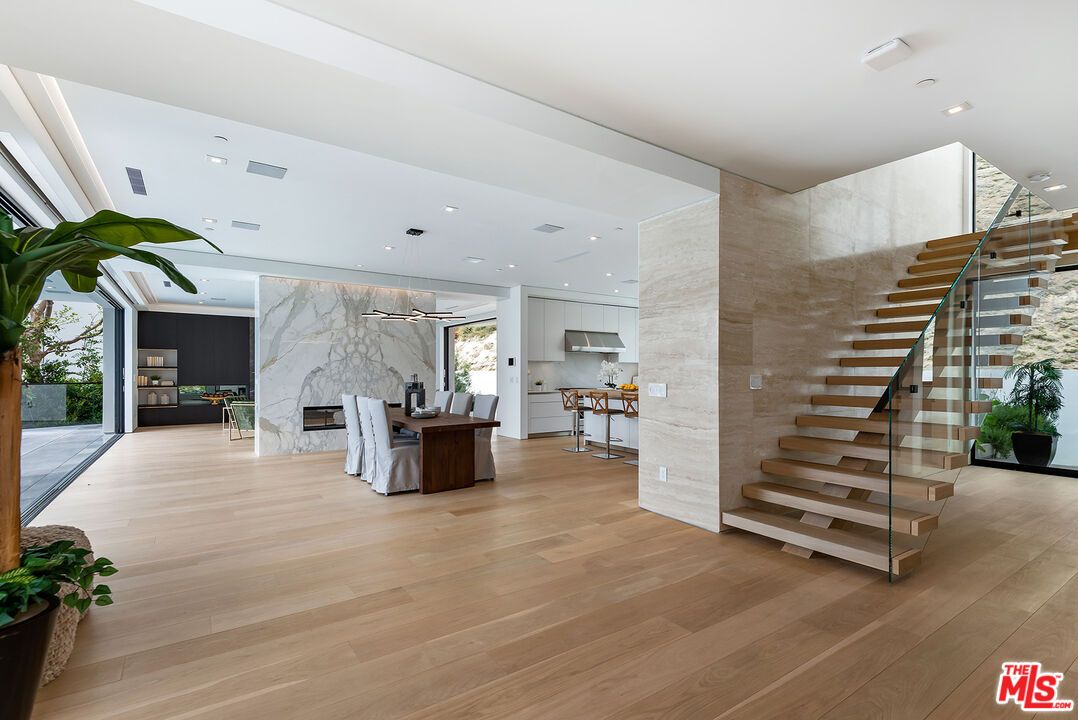 Fireplace, Interior, Kitchen, Marble Walls, Pendant Lights, Recessed Lighting, Wood Texture Flooring