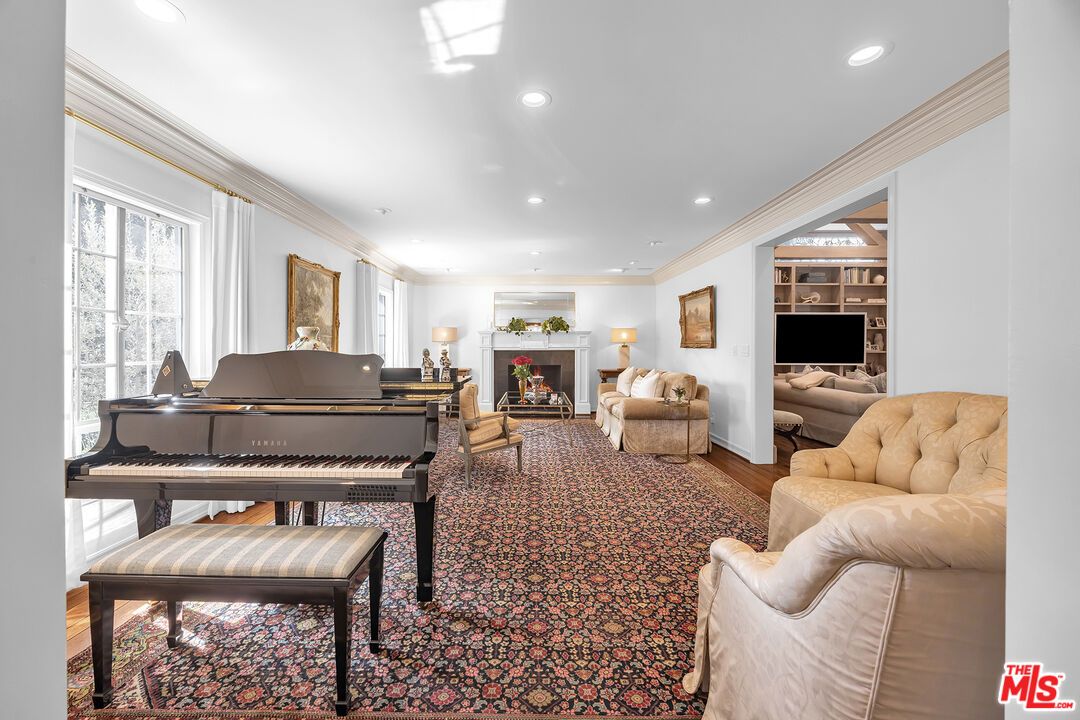 Fireplace, Interior, Living room, Piano, Recessed Lighting, Wood Texture Flooring