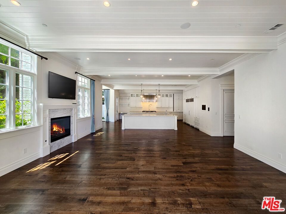 Empty room, Fireplace, Interior, Kitchen, Pendant Lights, Recessed Lighting, Wood Texture Flooring