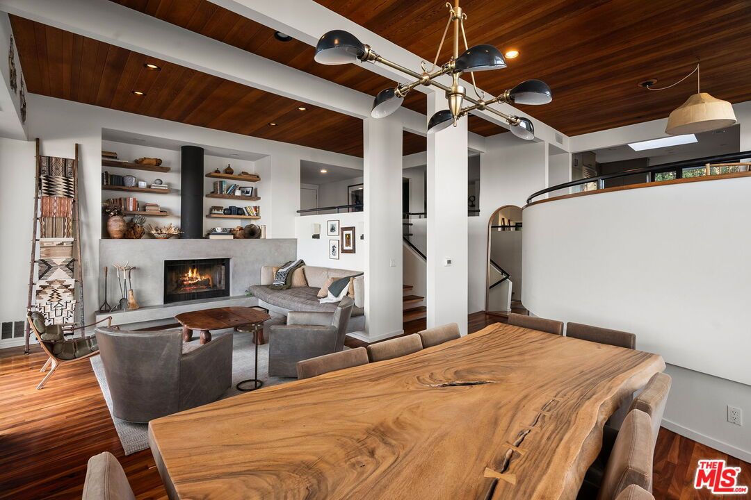 Dining room, Fireplace, Interior, Living room, Pendant Lights, Recessed Lighting, Wooden Ceilings, Wood Texture Flooring
