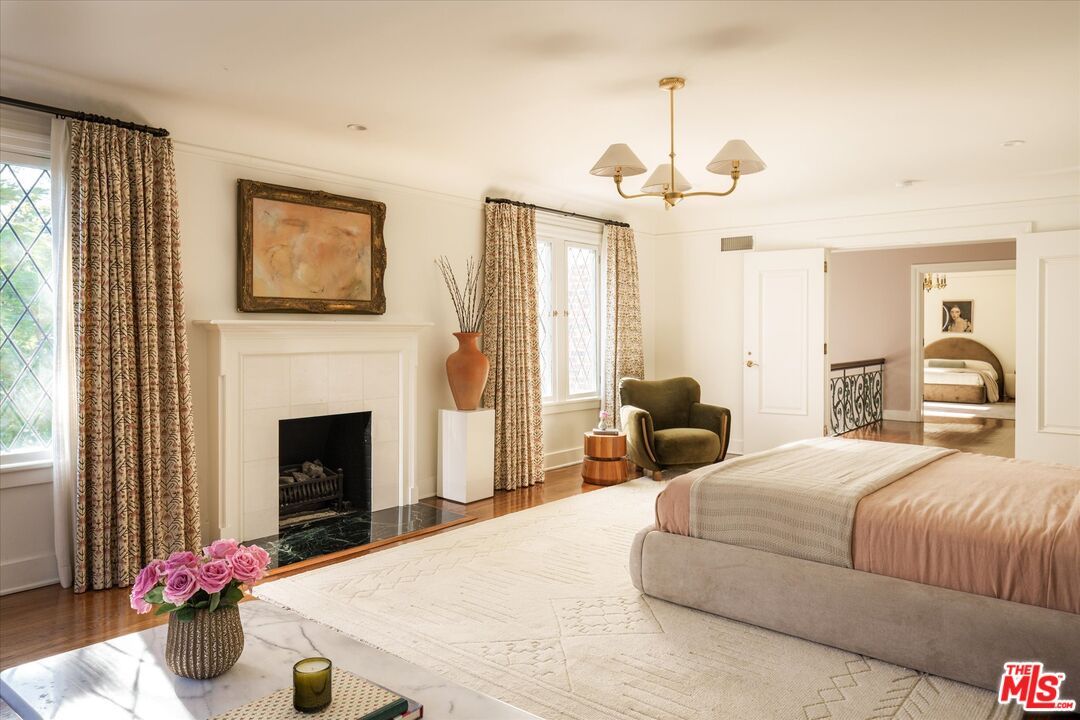 Bedroom, Chandelier, Fireplace, Interior, Wood Texture Flooring