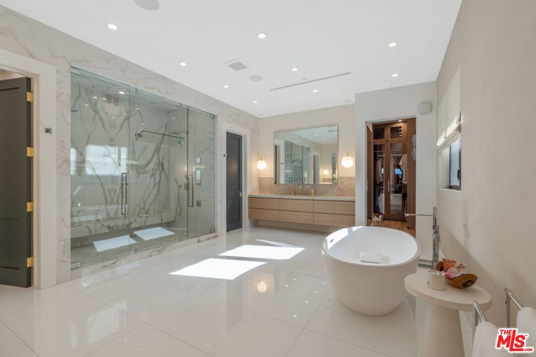 Bathroom, Dual Sink Vanities, Free Standing Baths, Glass Shower, Interior, Marble Walls, Recessed Lighting