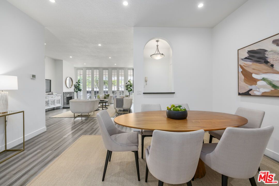 Dining room, Fireplace, Interior, Living room, Pendant Lights, Recessed Lighting, Wood Texture Flooring
