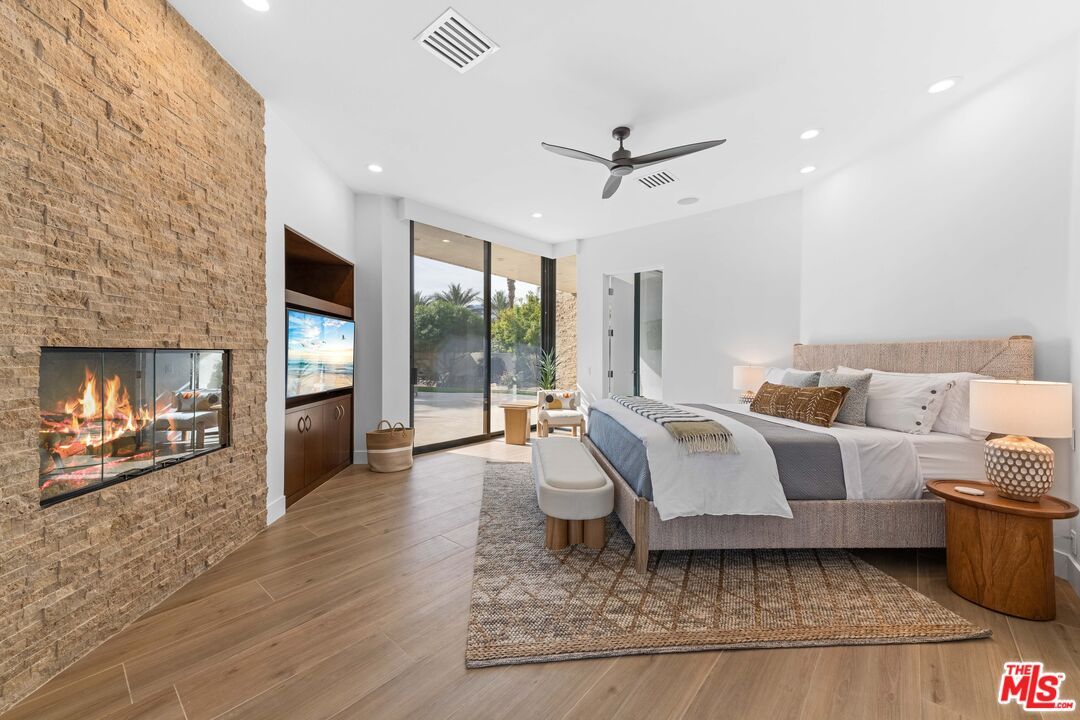 Bedroom, Fireplace, Interior, Recessed Lighting, Stone Walls, Wood Texture Flooring