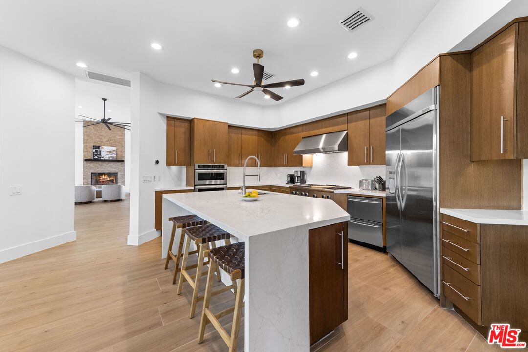 Fireplace, Interior, Kitchen, Pendant Lights, Recessed Lighting, Stainless Steel Appliances, Wood Texture Flooring