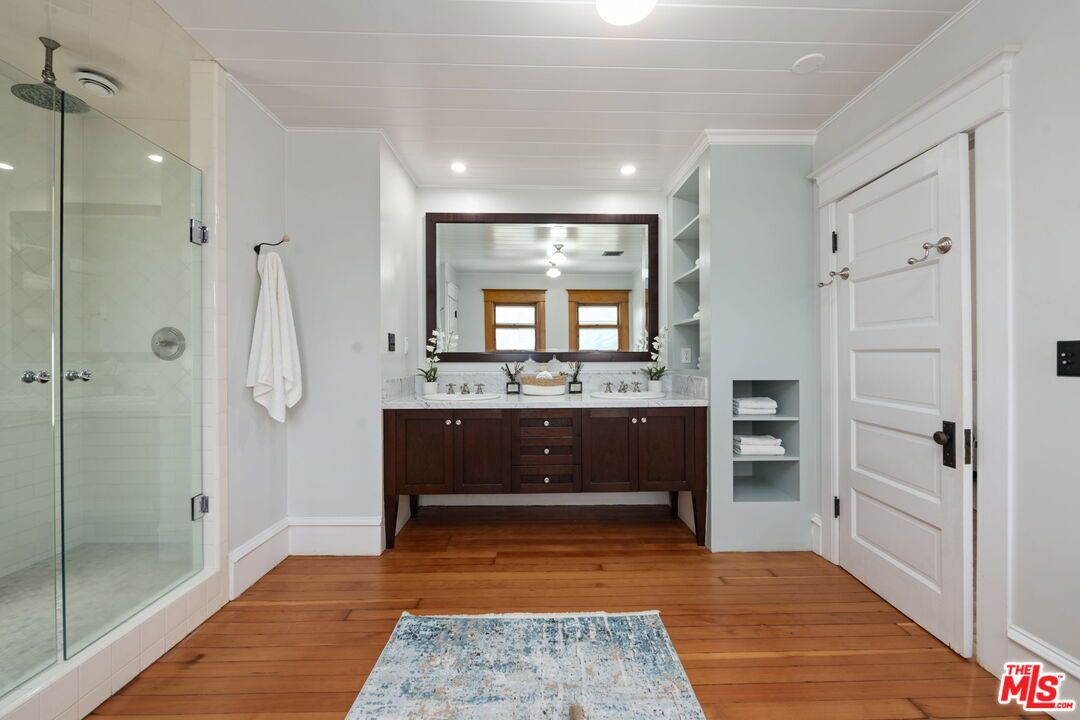 Bathroom, Dual Sink Vanities, Glass Shower, Interior, Recessed Lighting, Wood Texture Flooring