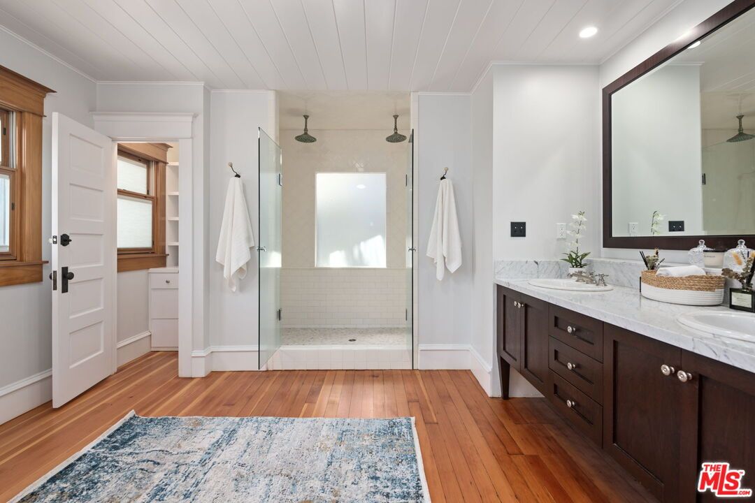 Bathroom, Dual Sink Vanities, Glass Shower, Interior, Recessed Lighting, Wood Texture Flooring