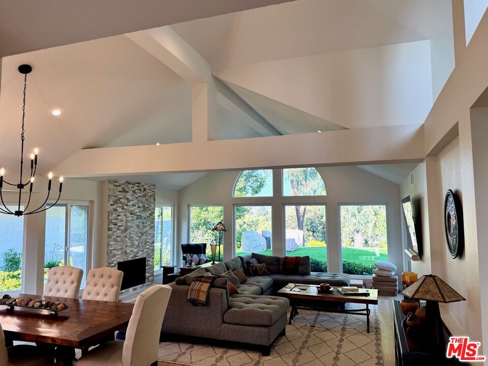 Chandelier, Dining room, Fireplace, Interior, Living room, Recessed Lighting, Stone Walls