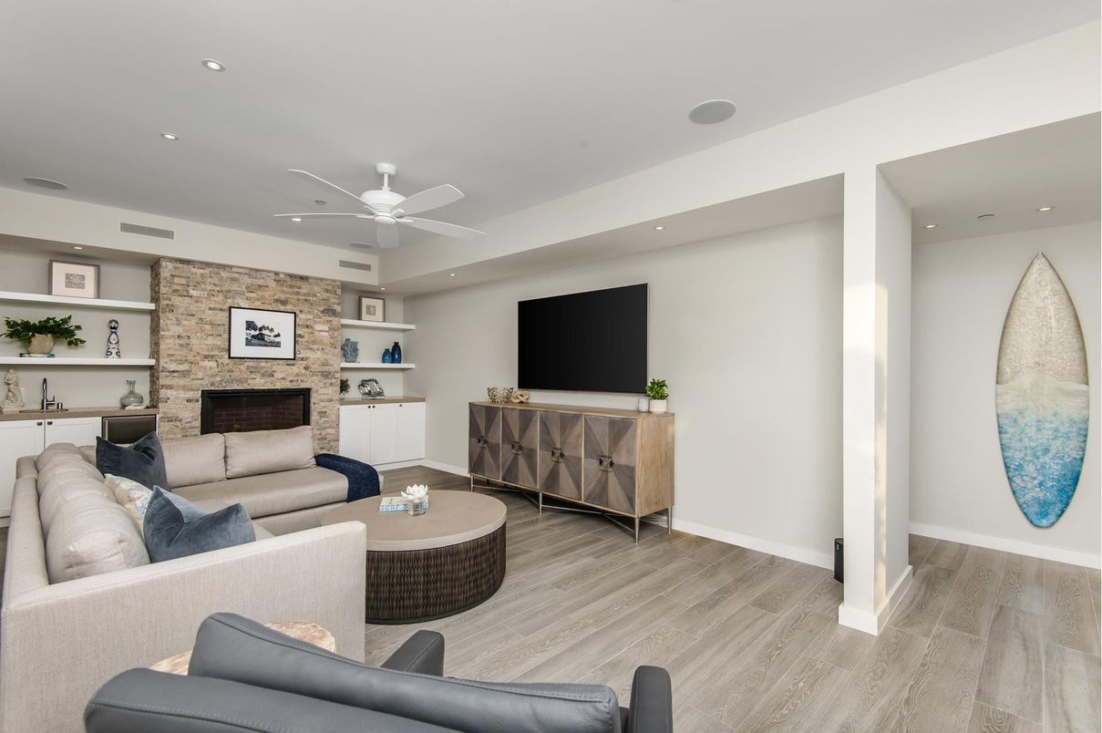 Fireplace, Interior, Living room, Recessed Lighting, Stone Walls, Wood Texture Flooring