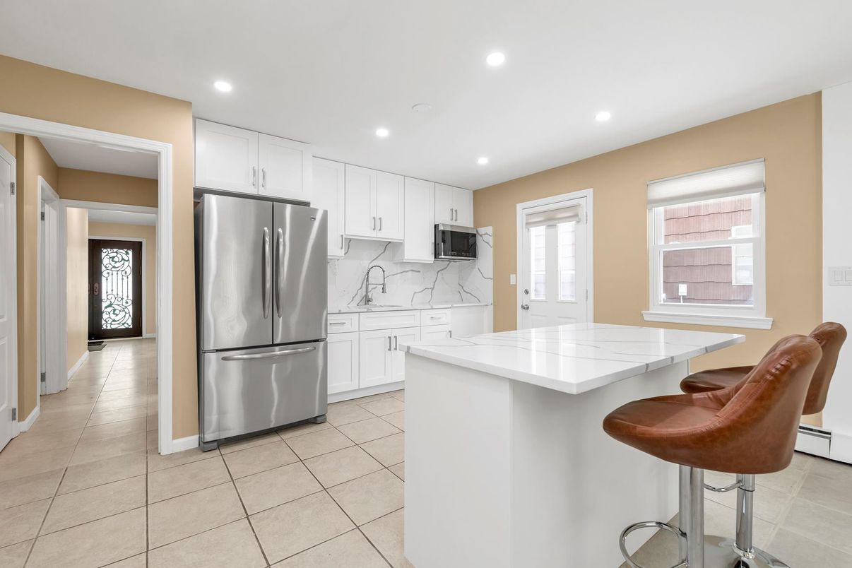 Interior, Kitchen, Marble Walls, Recessed Lighting, Stainless Steel Appliances