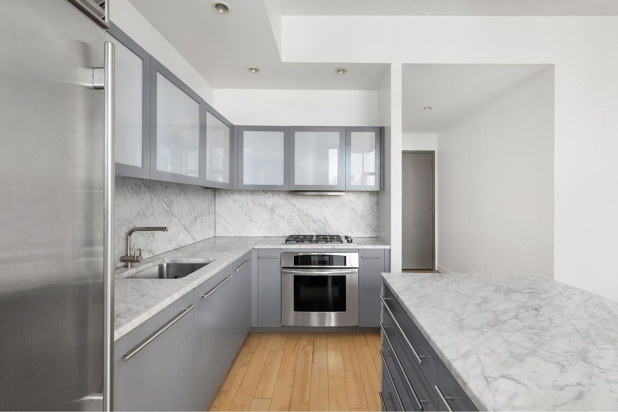 Interior, Kitchen, Marble Walls, Recessed Lighting, Stainless Steel Appliances, Wood Texture Flooring