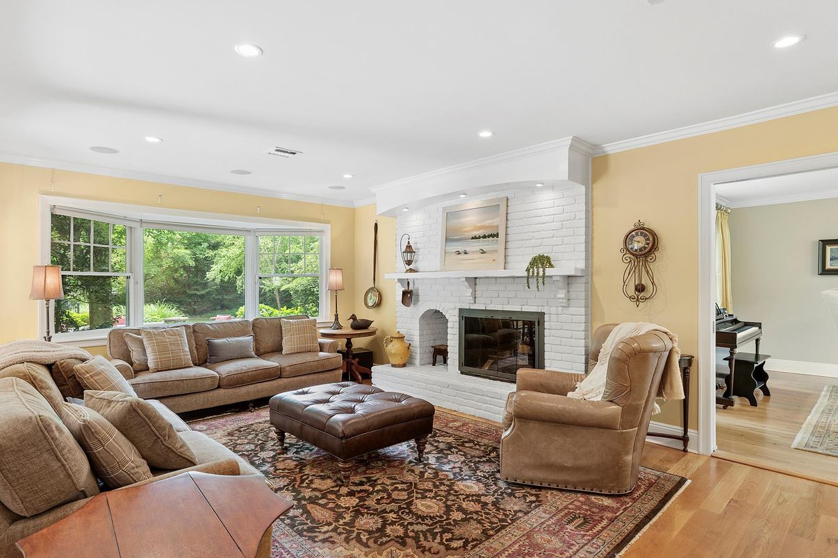 Fireplace, Interior, Living room, Piano, Recessed Lighting, Stone Walls, Wood Texture Flooring