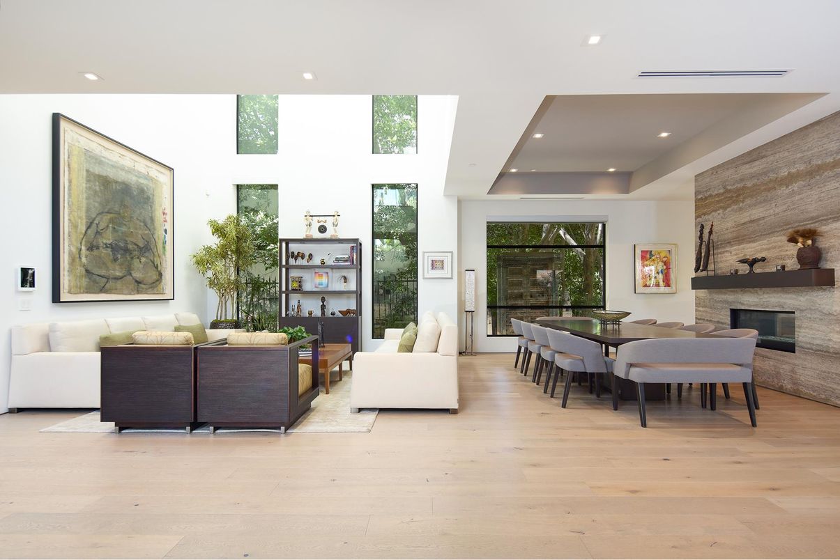 Dining room, Fireplace, Interior, Living room, Recessed Lighting, Stone Walls, Wood Texture Flooring