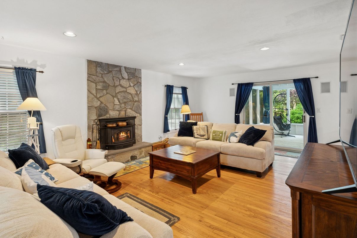 Fireplace, Interior, Living room, Recessed Lighting, Stone Walls, Wood Texture Flooring