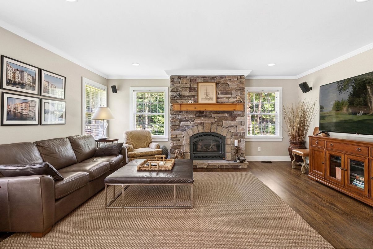 Fireplace, Interior, Living room, Recessed Lighting, Stone Walls, Wood Texture Flooring