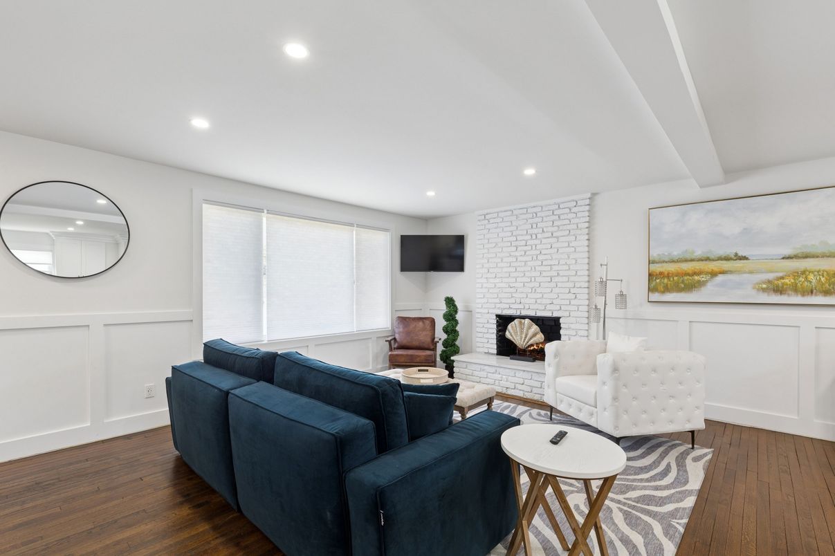 Fireplace, Interior, Living room, Recessed Lighting, Stone Walls, Wood Texture Flooring