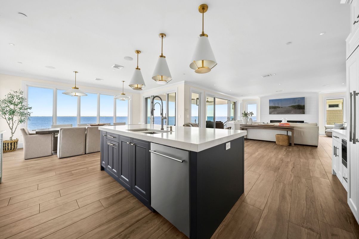 Dining room, Interior, Kitchen, Living room, Pendant Lights, Recessed Lighting, Stainless Steel Appliances, Water, Wood Texture Flooring