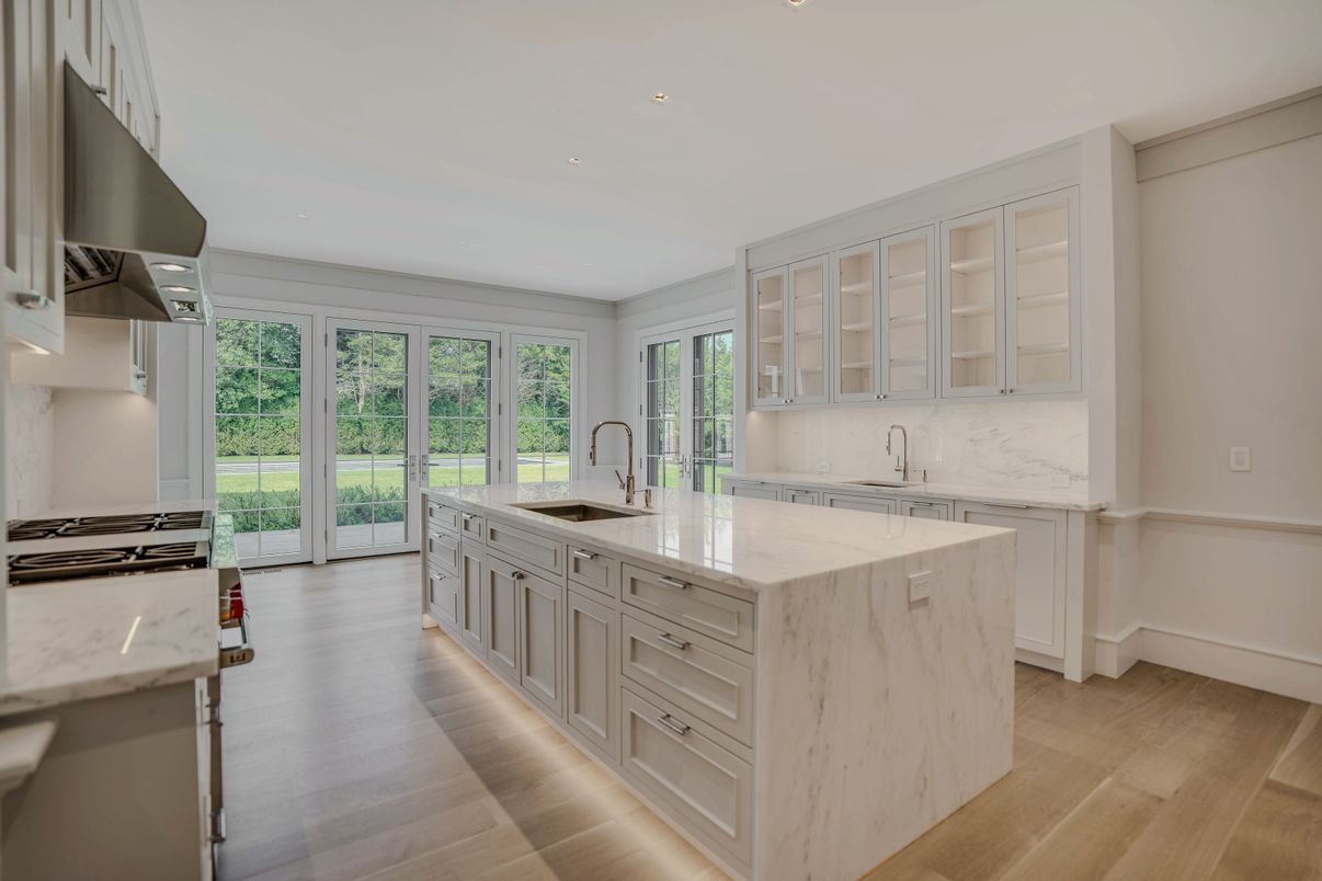 Interior, Kitchen, Marble Walls, Recessed Lighting, Stainless Steel Appliances, Wood Texture Flooring